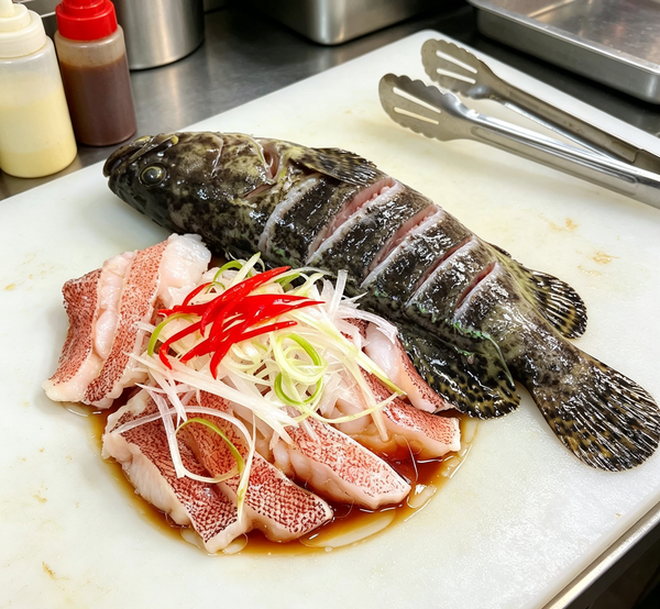Steamed Whole Fish with Ginger and Chili Garnish